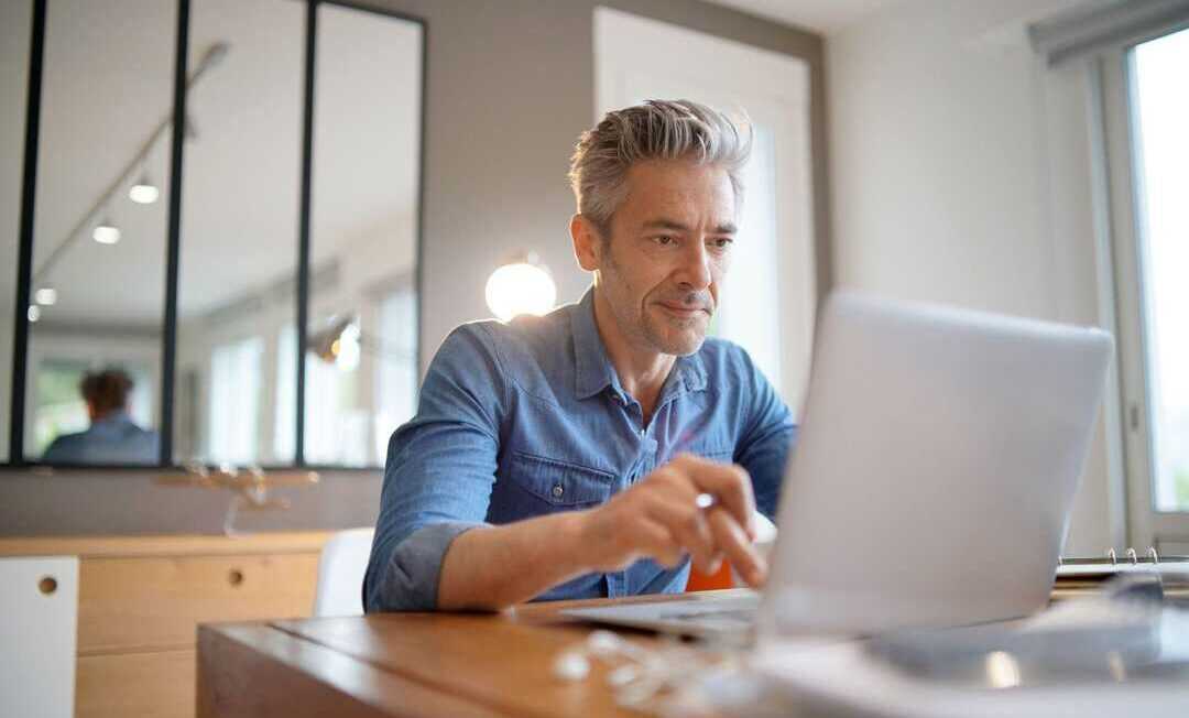 Mature man working from contemporary home
