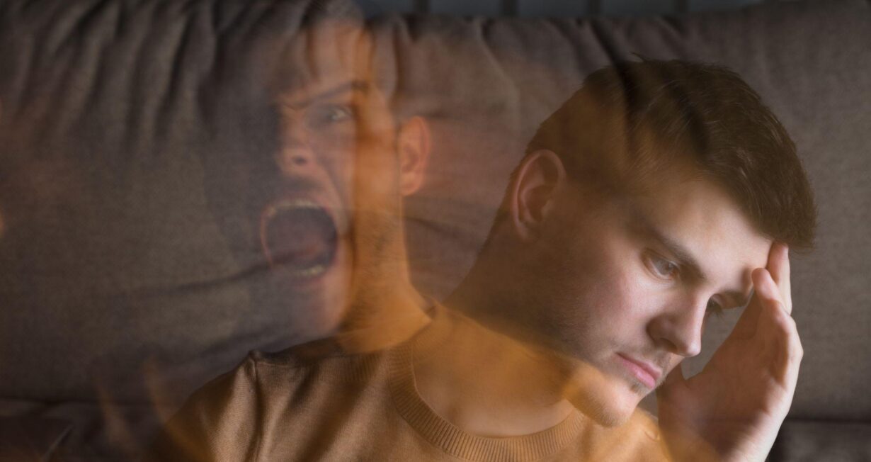 Multi exposure of young angry and stressed man at home